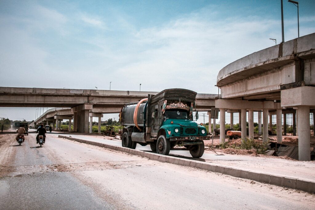 pexels-photo-1299383-1299383 Tanker truck and vehicles on a highway in Kotri, Sindh, Pakistan. Urban transportation system.
